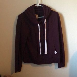 A purple/maroon sweater